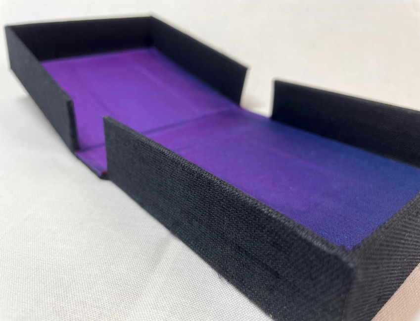 clamshell box open with purple lining